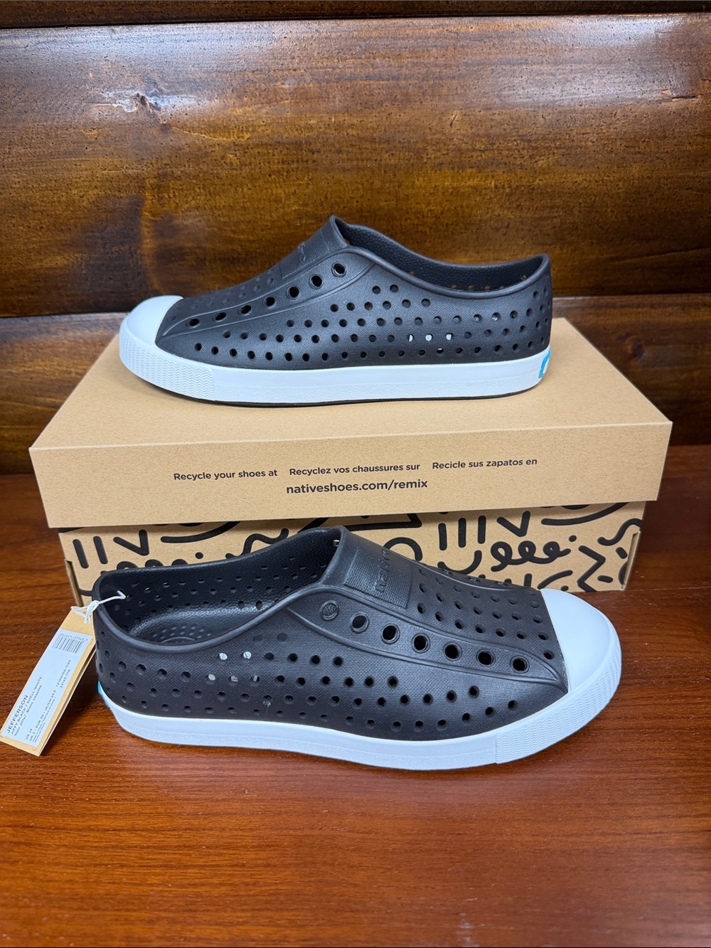 Kids Native Slip-On Sneakers in Black and White